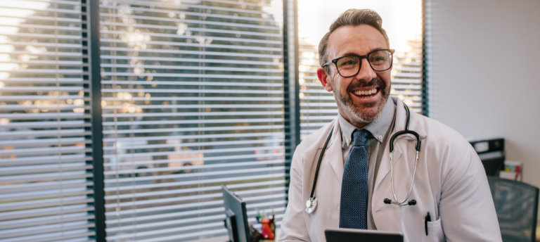 Doctor with Digital Tablet in His Office