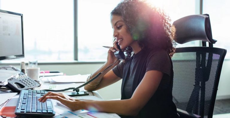 Businesswoman Working at Her Desk in Office